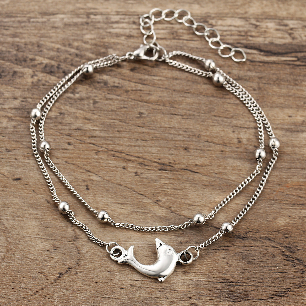 Damenarmband mit verspieltem Delphin-Anhänger Shop Nory