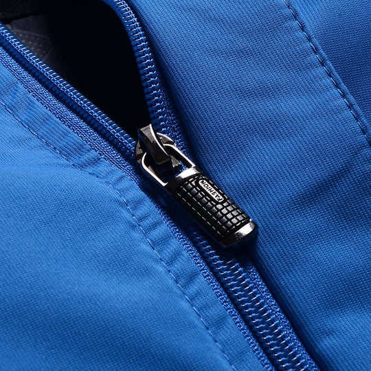 Herren dreilagige Softshell-Outdoorjacke mit abnehmbarer Kapuze und verschweißten Nähten Shop Nory