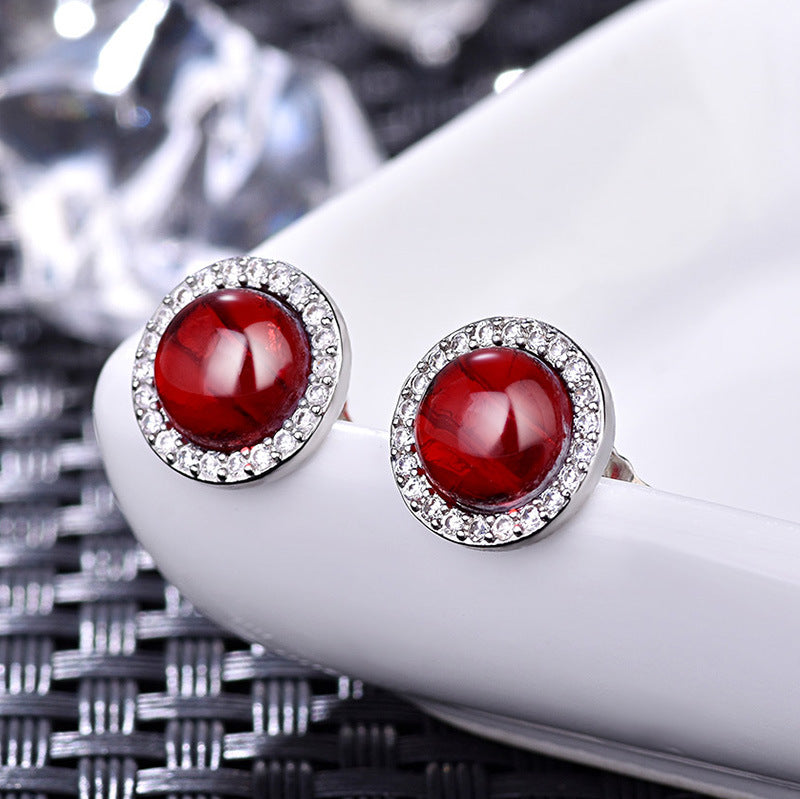 Damenohrringe mit leuchtendem jadegrünem Stein und glitzerndem Zirkonia-Rahmen Shop Nory