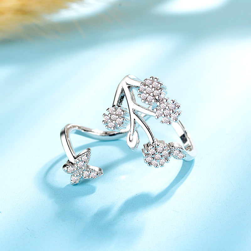 Damen Offener Ring mit floralem Design und funkelnden Zirkonia-Details Shop Nory