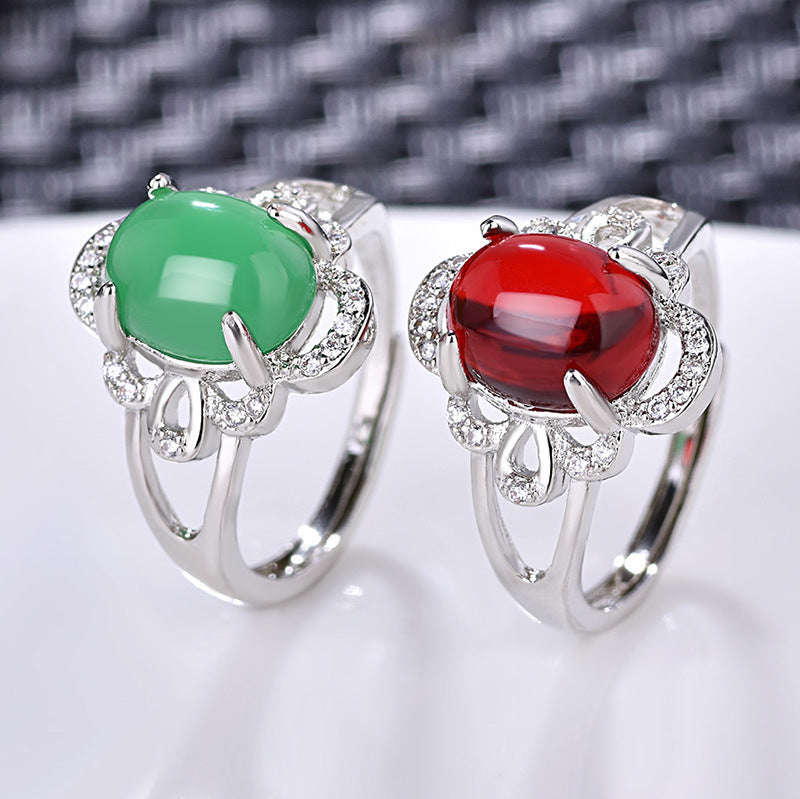 Damenring mit rotem Edelstein in kunstvollem Design und funkelndem Zirkonia-Besatz Shop Nory