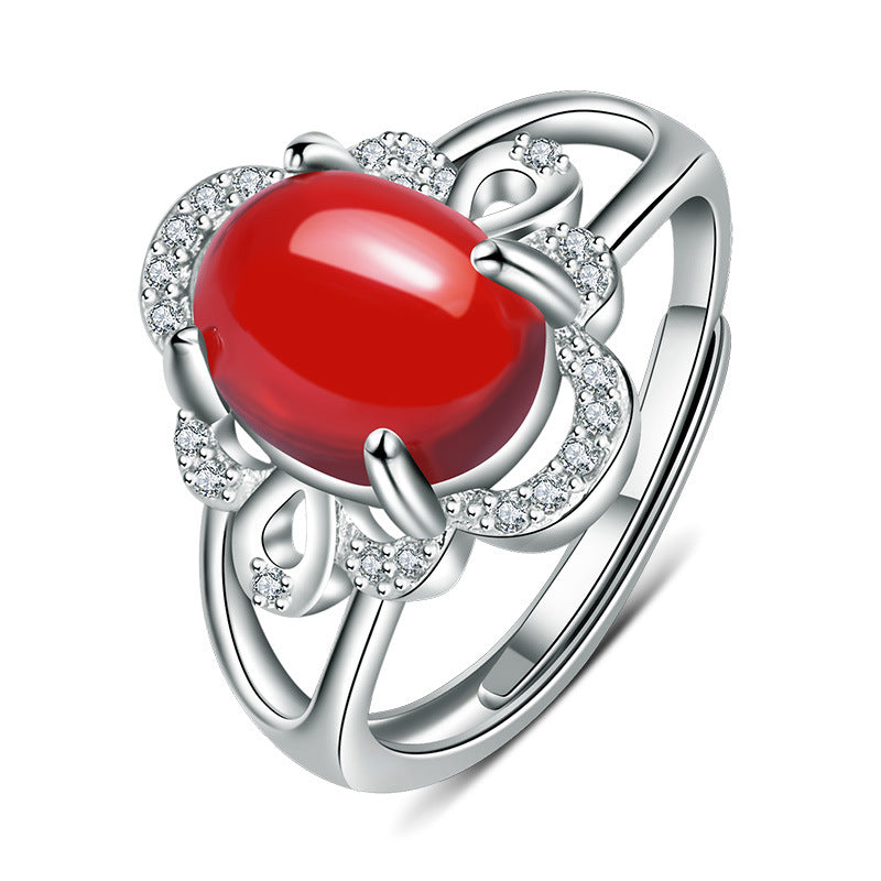 Damenring mit rotem Edelstein in kunstvollem Design und funkelndem Zirkonia-Besatz Shop Nory