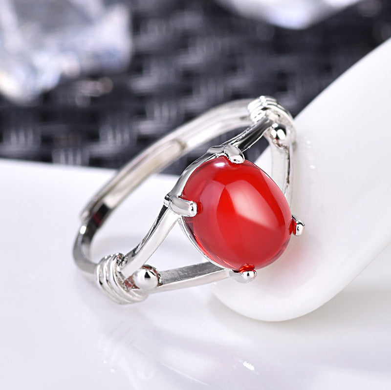 Damenring mit rotem Stein in kunstvollem Design Shop Nory