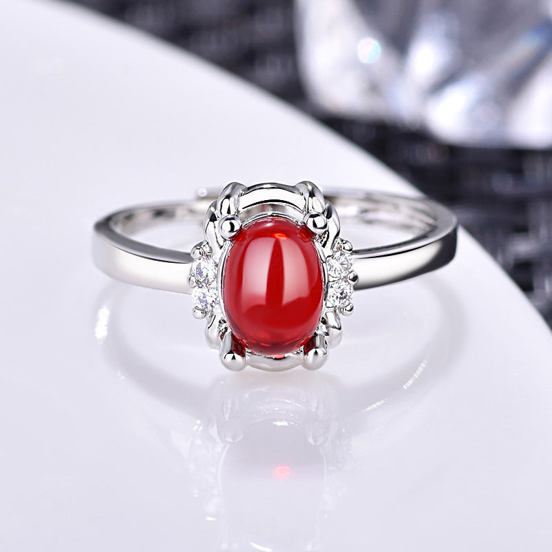 Damenring mit elegantem rotem Stein und funkelndem Zirkonia-Besatz Shop Nory