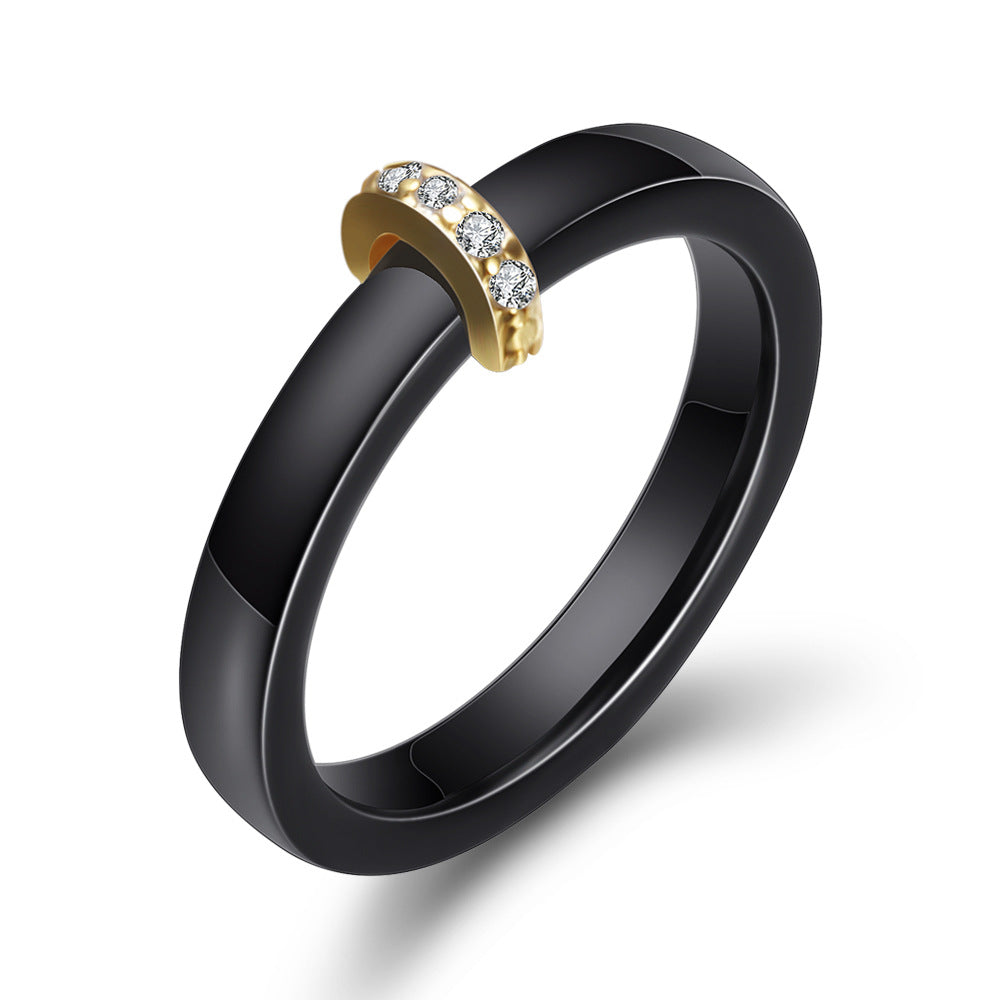 Damen Ring mit elegantem schwarzem Keramikkern und goldenem Zirkonia-Besatz Shop Nory