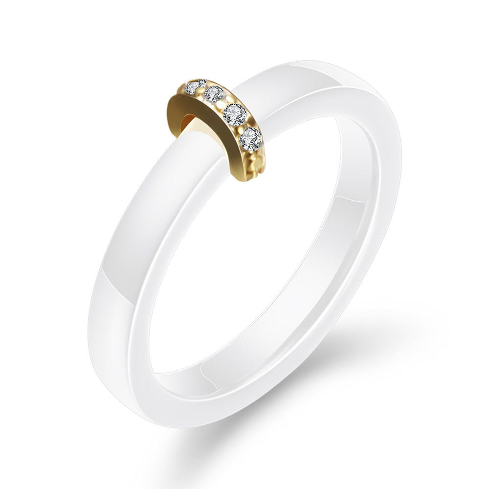 Damen Ring mit elegantem schwarzem Keramikkern und goldenem Zirkonia-Besatz Shop Nory