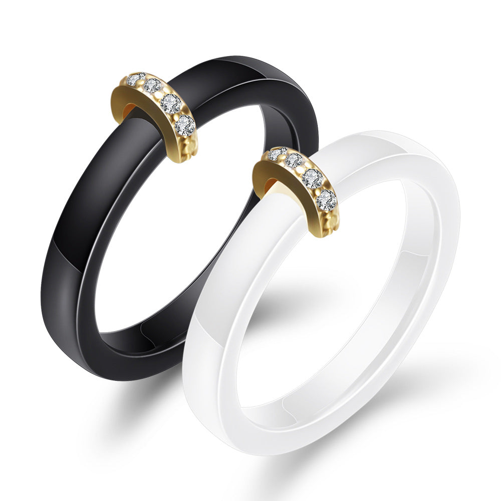 Damen Ring mit elegantem schwarzem Keramikkern und goldenem Zirkonia-Besatz Shop Nory