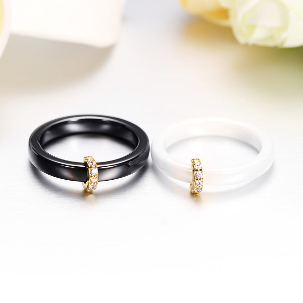 Damen Ring mit elegantem schwarzem Keramikkern und goldenem Zirkonia-Besatz Shop Nory