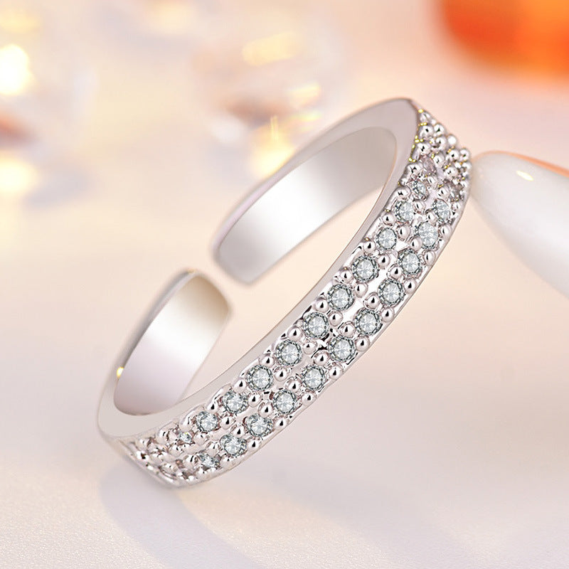 Damen Offener Ring mit funkelnden Zirkonia-Elementen und modernem Design Shop Nory