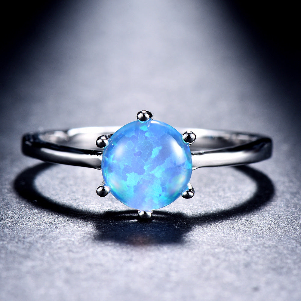 Damen Ring mit funkelndem Opal und eleganter Edelstahlfassung Shop Nory