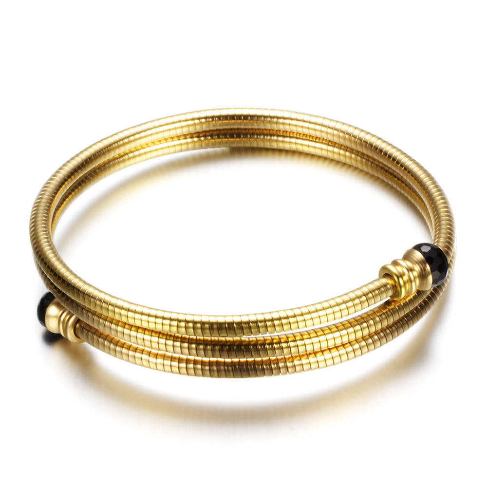 Damen Armreif mit elegantem, geschwungenem Design und funkelnden Akzenten Shop Nory