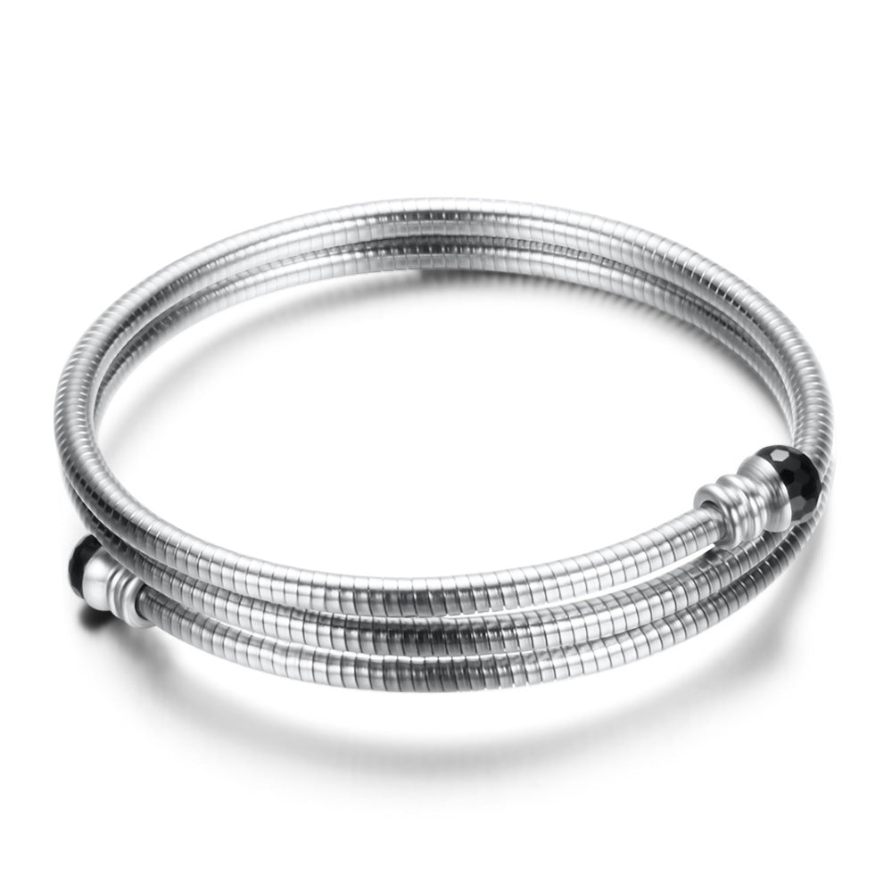 Damen Armreif mit elegantem, geschwungenem Design und funkelnden Akzenten Shop Nory