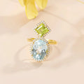 Ring mit blauem Topas und Peridot mit zwei großen Edelsteinen einzigartiger Verlobungsring | Shop Nory