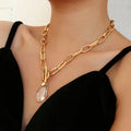 Goldbeschichtete Chunky-Link-Kette & durchsichtiger Kristall-Wassertropfen-Anhänger | Shop Nory