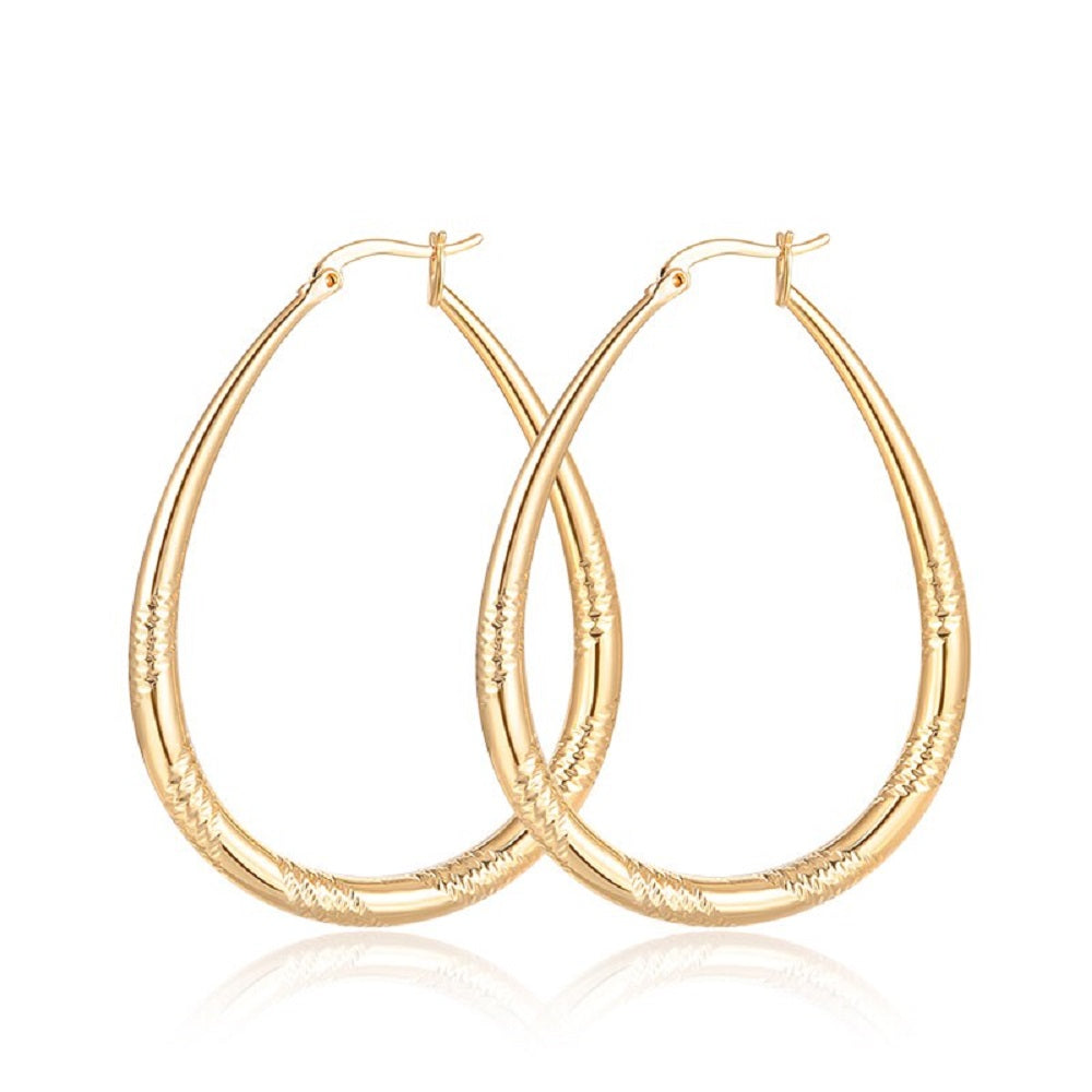 Große glänzende vergoldete ovale geschnitzte Cut-Hoops-Ohrringe | Shop Nory