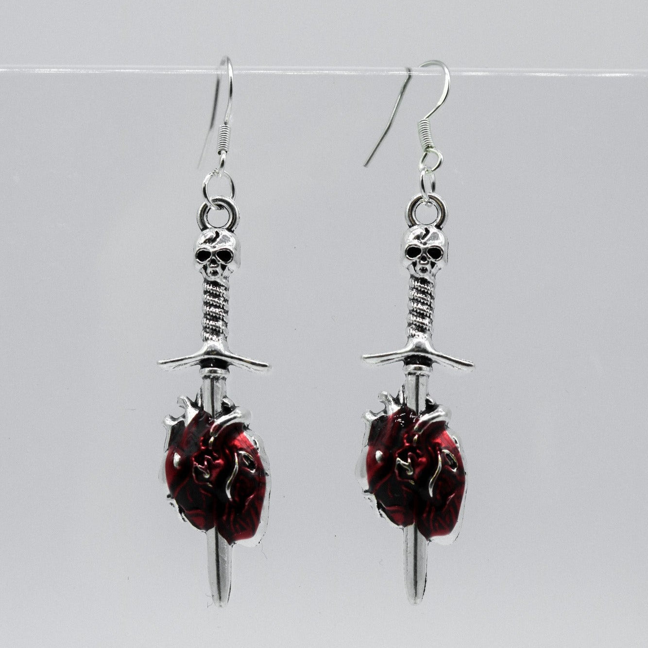 Silver and Red Anatomical Heart with Sword Charm Earrings | Shop Nory