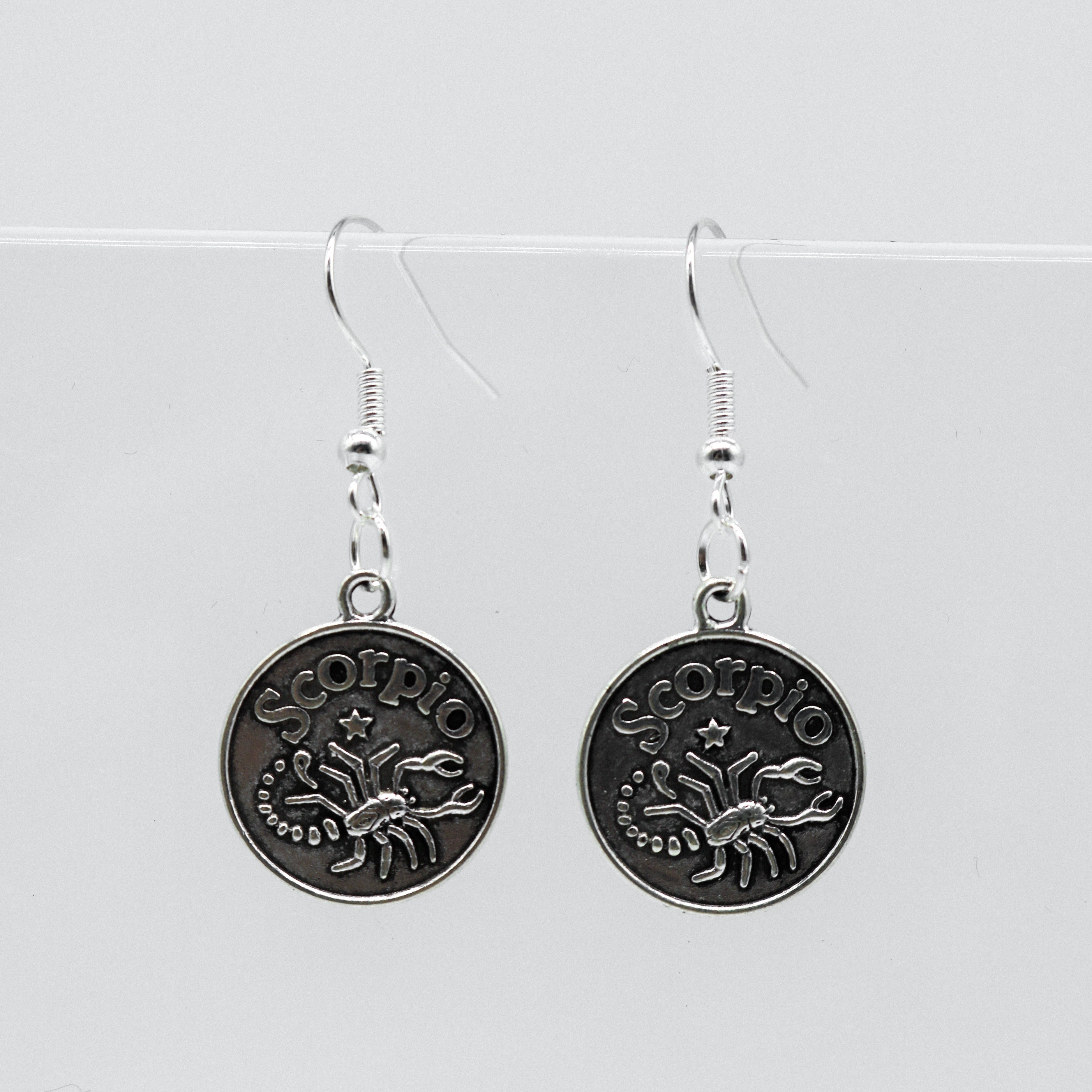 Silver Earrings With Reversible Zodiac Coin Charm | Shop Nory