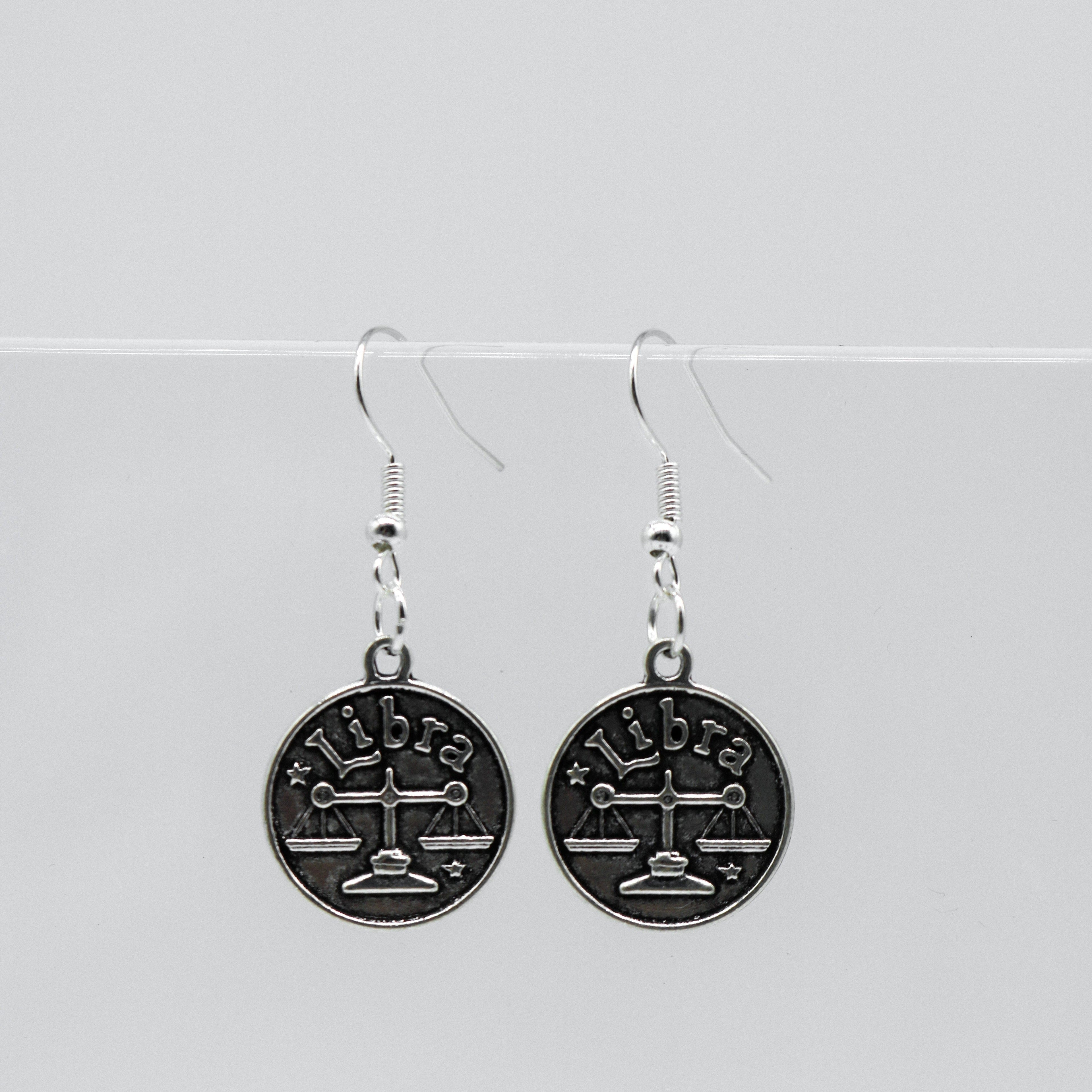 Silver Earrings With Reversible Zodiac Coin Charm | Shop Nory