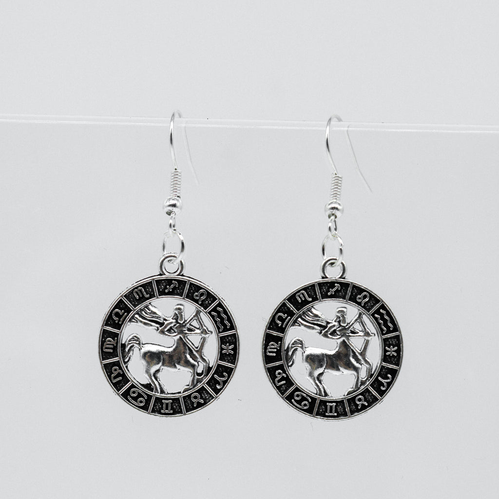 Silberohrringe mit Zodiac-Symbol-Münzanhänger | Shop Nory