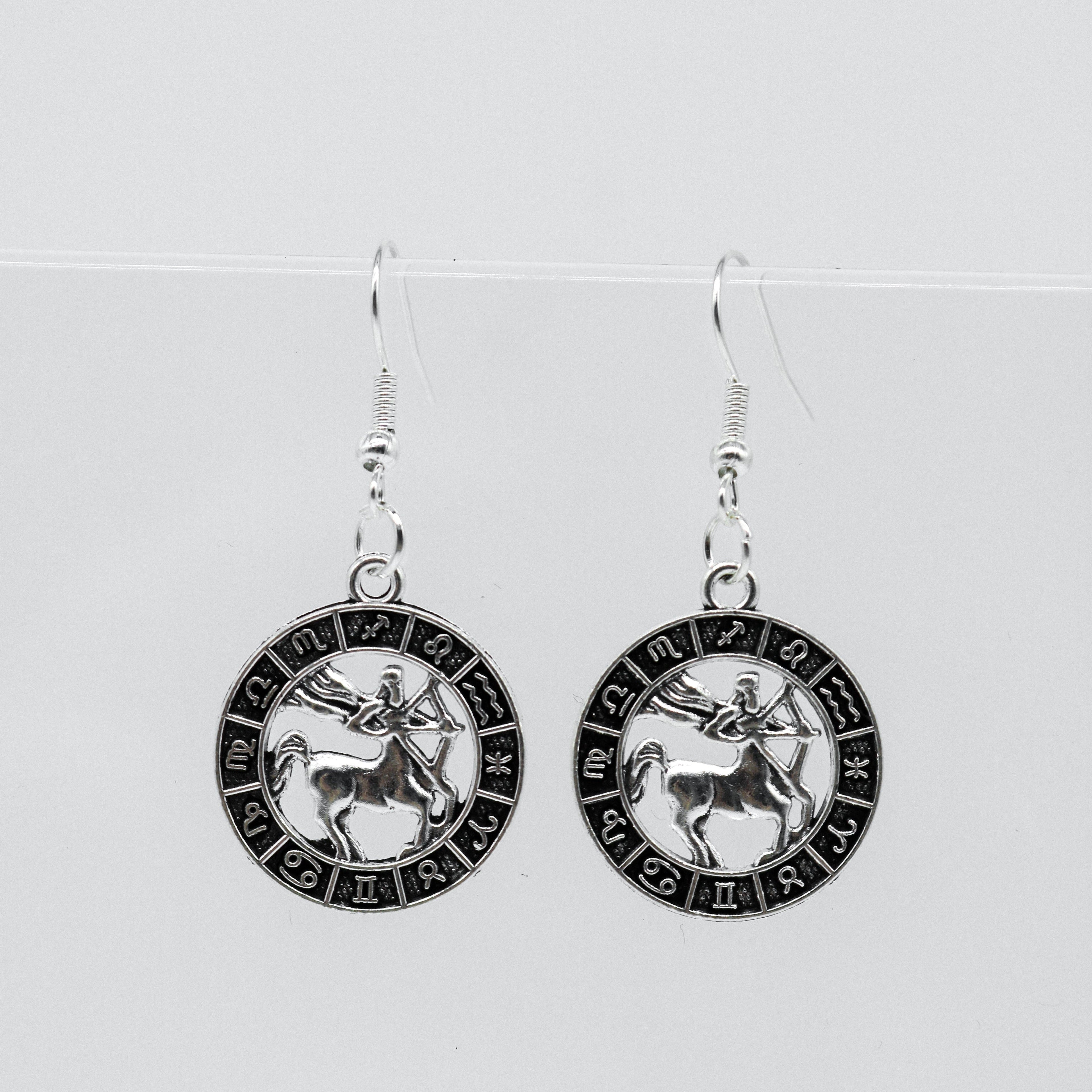 Silberohrringe mit Zodiac-Symbol-Münzanhänger | Shop Nory