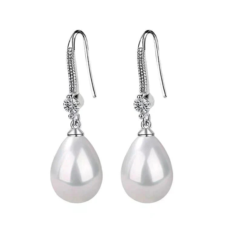 Weiße ovale Perlenohrringe | Shop Nory