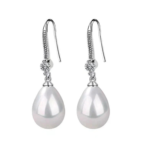 Weiße ovale Perlenohrringe | Shop Nory