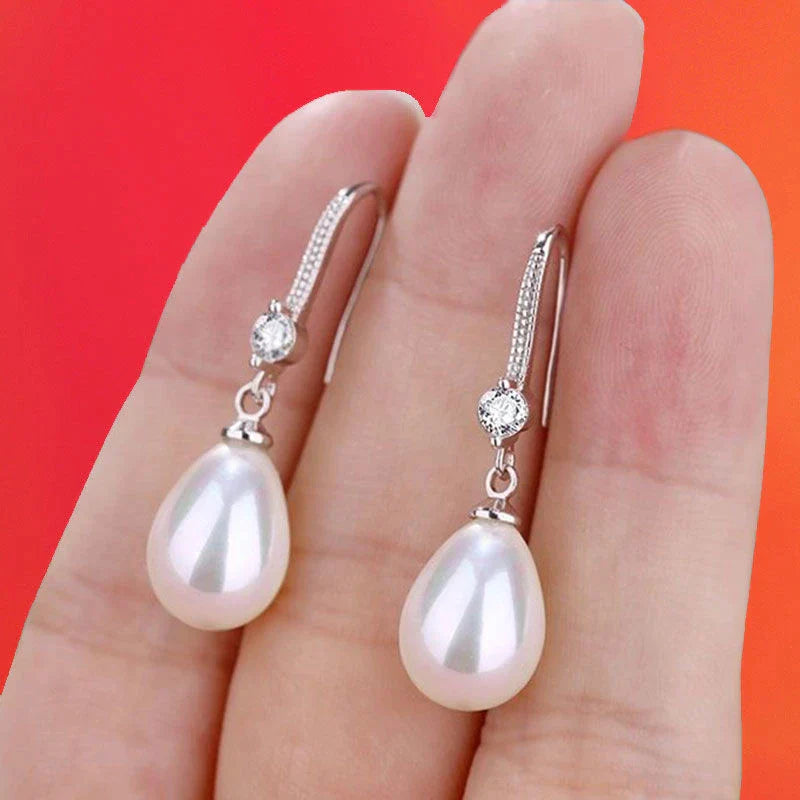Weiße ovale Perlenohrringe | Shop Nory