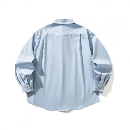 Unisex Oversize-Hemd mit Button-Down-Kragen, Brusttasche und gerundetem Saum Shop Nory