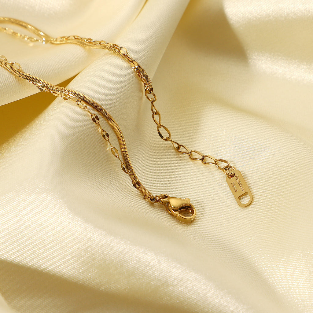 Damen Armband mit feinem Kettendesign und eleganten Zirkonsteinen Shop Nory