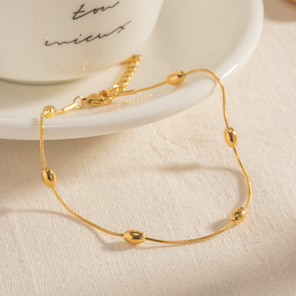 Damen Edelstahl-Armband mit goldfarbener Kugelverzierung und verstellbarem Verschluss Shop Nory