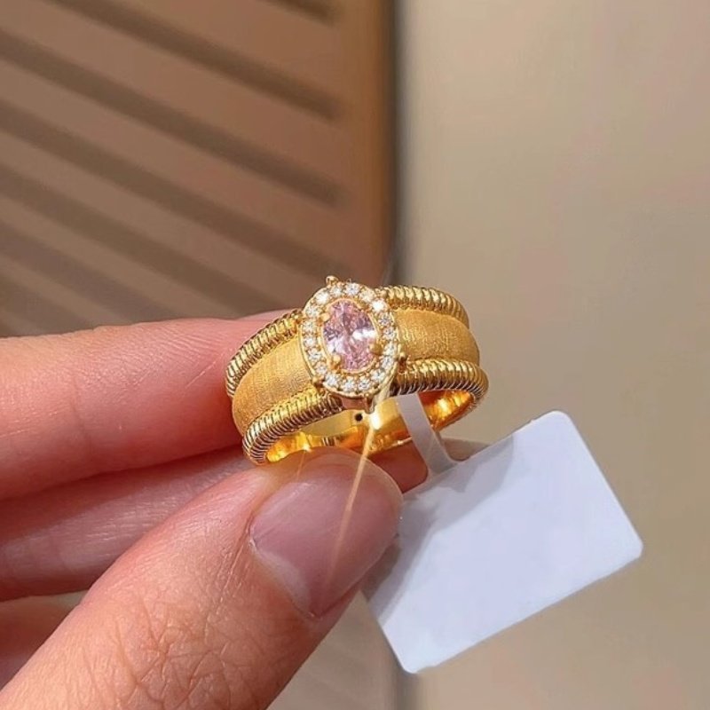 Damenring mit blauem Edelstein und kunstvollem Golddesign Shop Nory