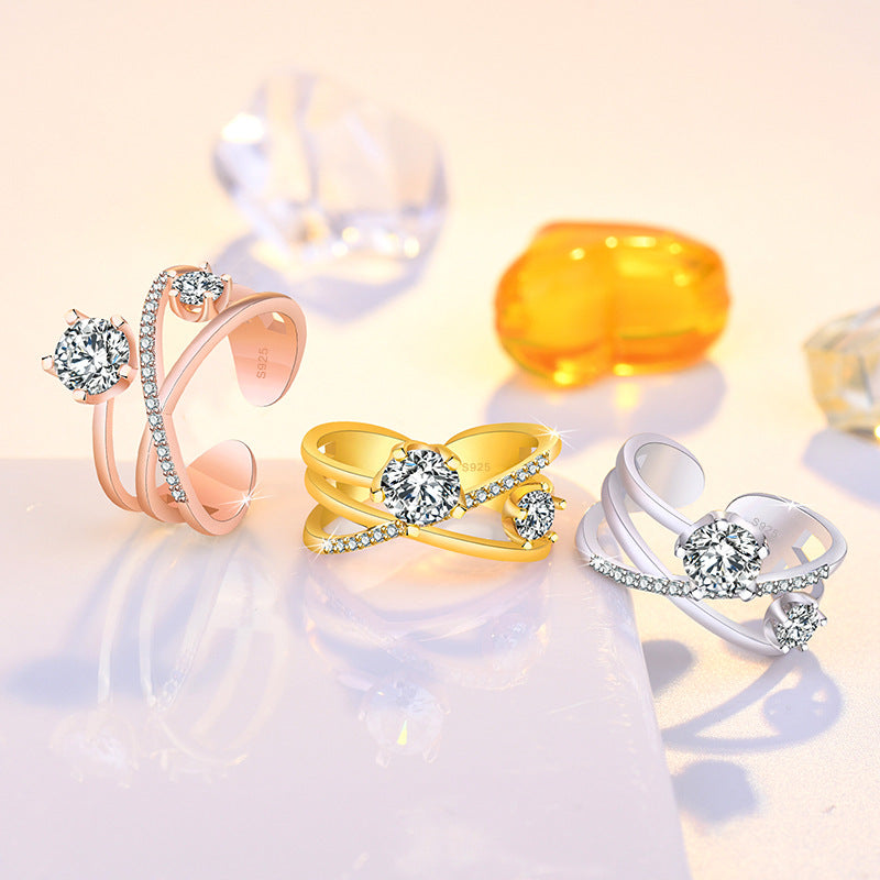 Damen Ring mit funkelnden Zirkonia und elegantem Kreuzdesign Shop Nory