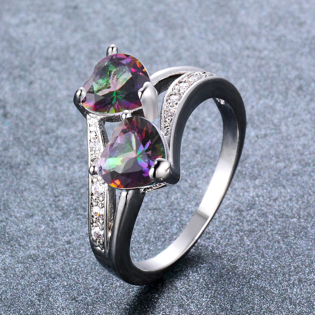 Damen Ring mit zwei herzförmigen blauen Zirkonen und funkelnden Zirkonia-Details Shop Nory