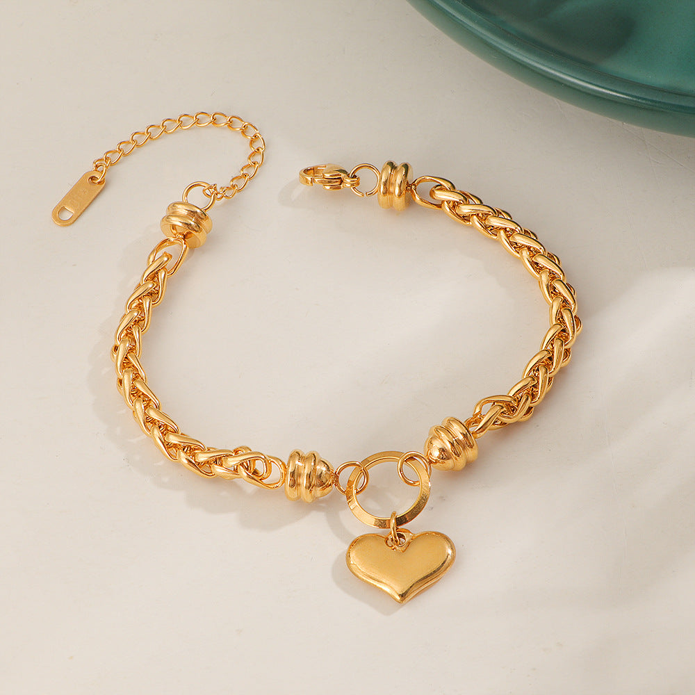 Damen liebevolles Armband mit herzförmigem Anhänger und kunstvollem Geflecht Shop Nory