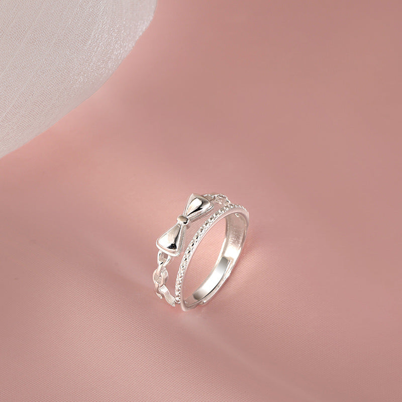 Damen zierlicher Ring mit verspieltem Schleifenmotiv und feinen Zirkonia Akzenten Shop Nory