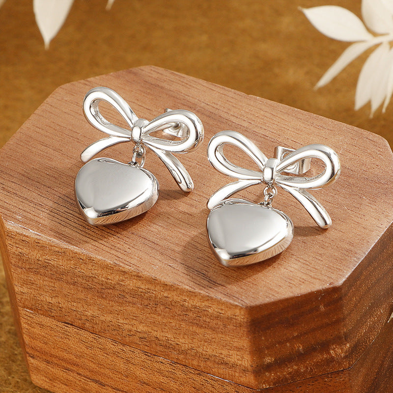 Damen elegante Ohrringe mit herzförmigem Anhänger und Schleifendesign Shop Nory