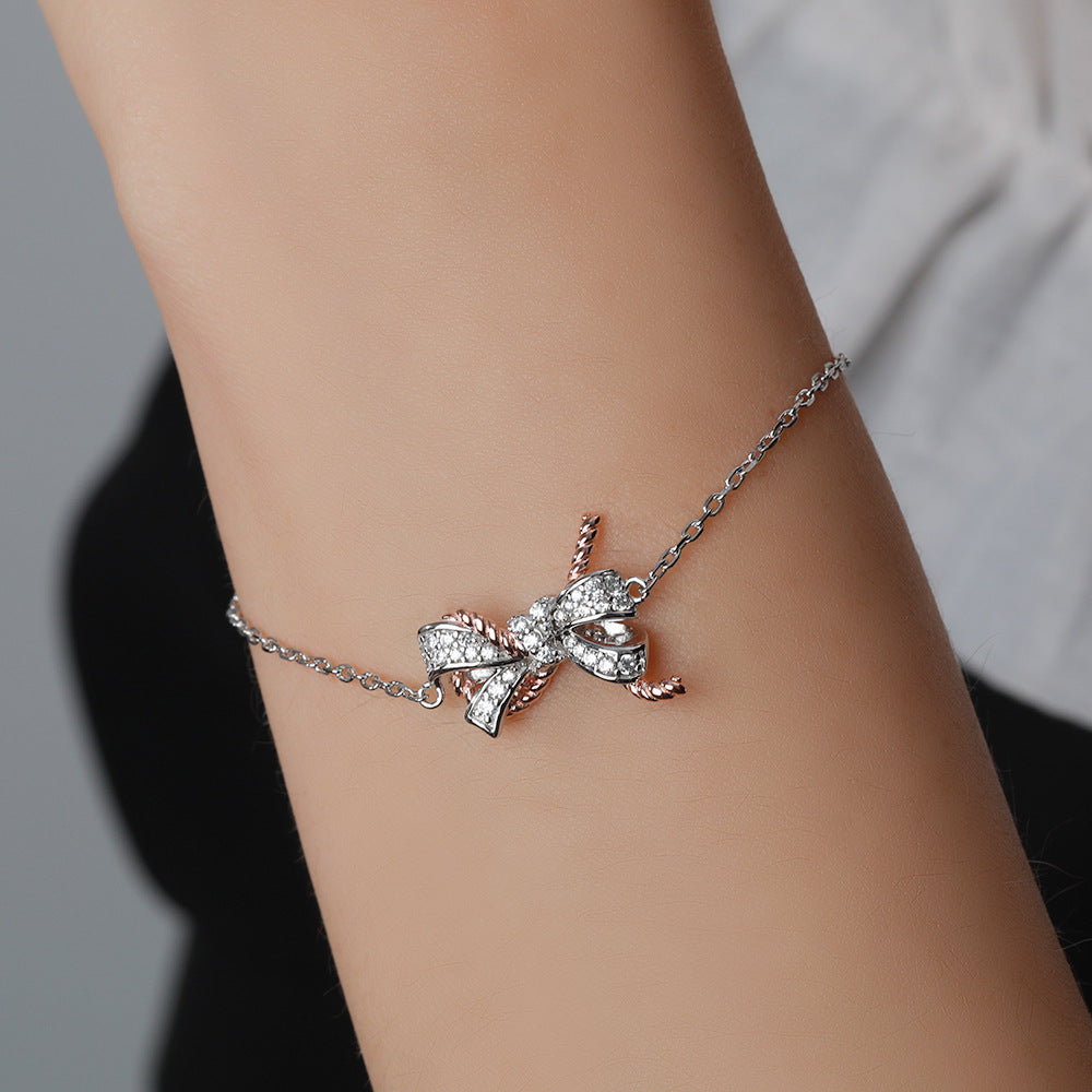 Damenarmband mit funkelndem Schleifenmotiv und Zirkonia-Besatz Shop Nory