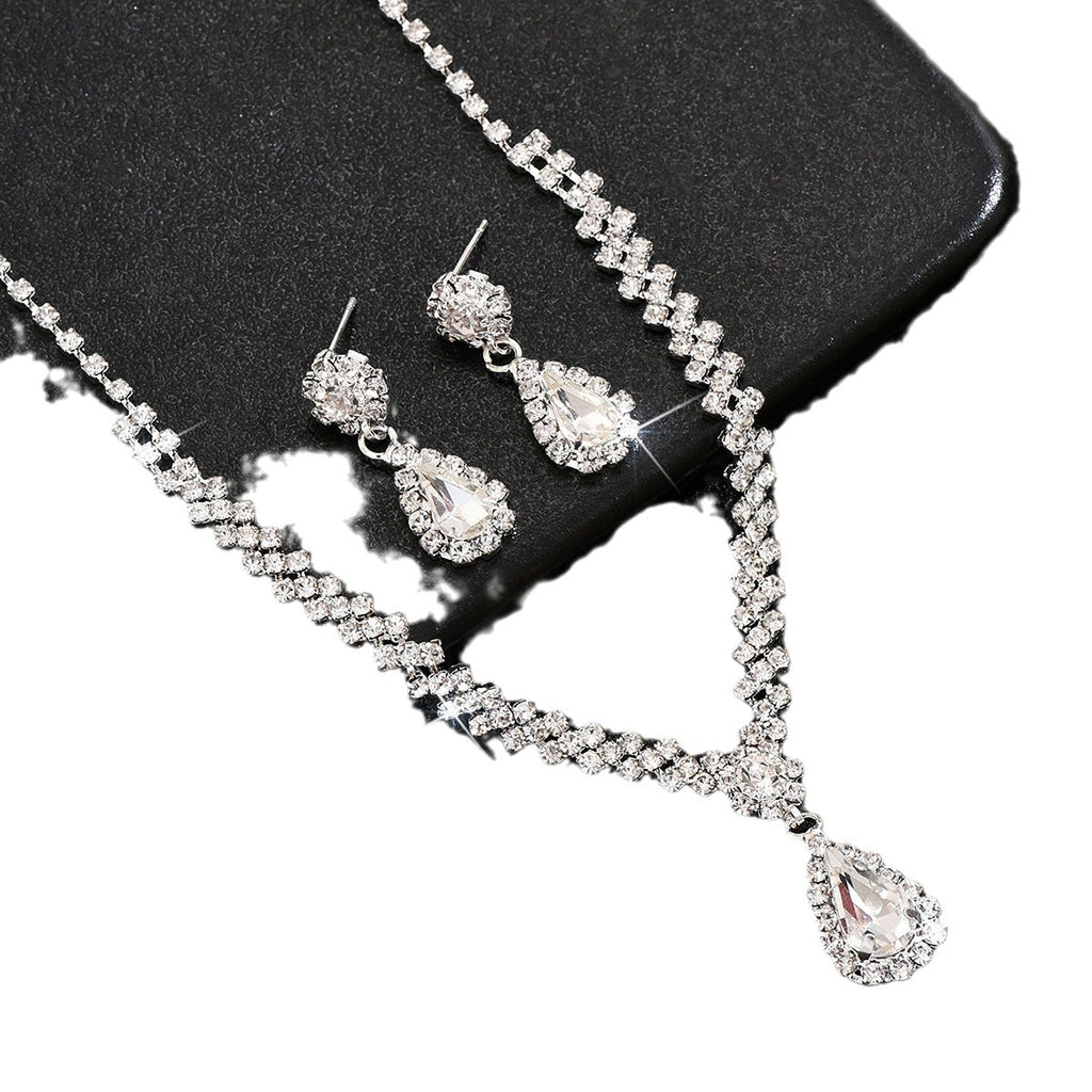 Tropfenpendant und passendes Tropfohrschmuckset für Braut mit kubischem Zirkonia-Halo