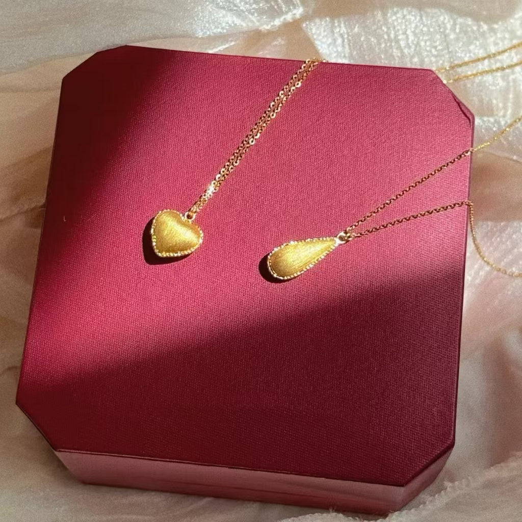 Damen Halskette mit herzförmigem Anhänger aus glänzendem Metall Shop Nory