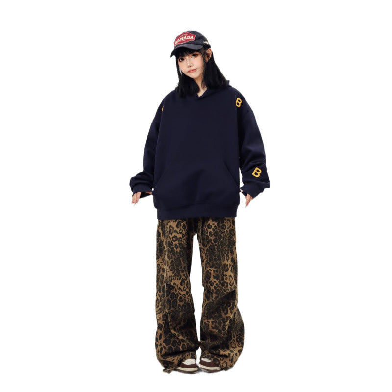 Unisex Oversized Kapuzenpullover mit großflächigem Intarsien‑Blockprint und geripptem Saum Shop Nory