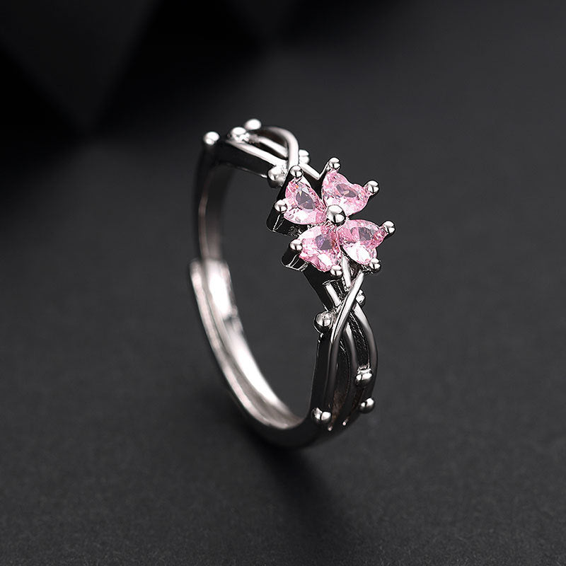 Damenring mit floralem Design und funkelnden pinken Zirkonia-Steinen Shop Nory