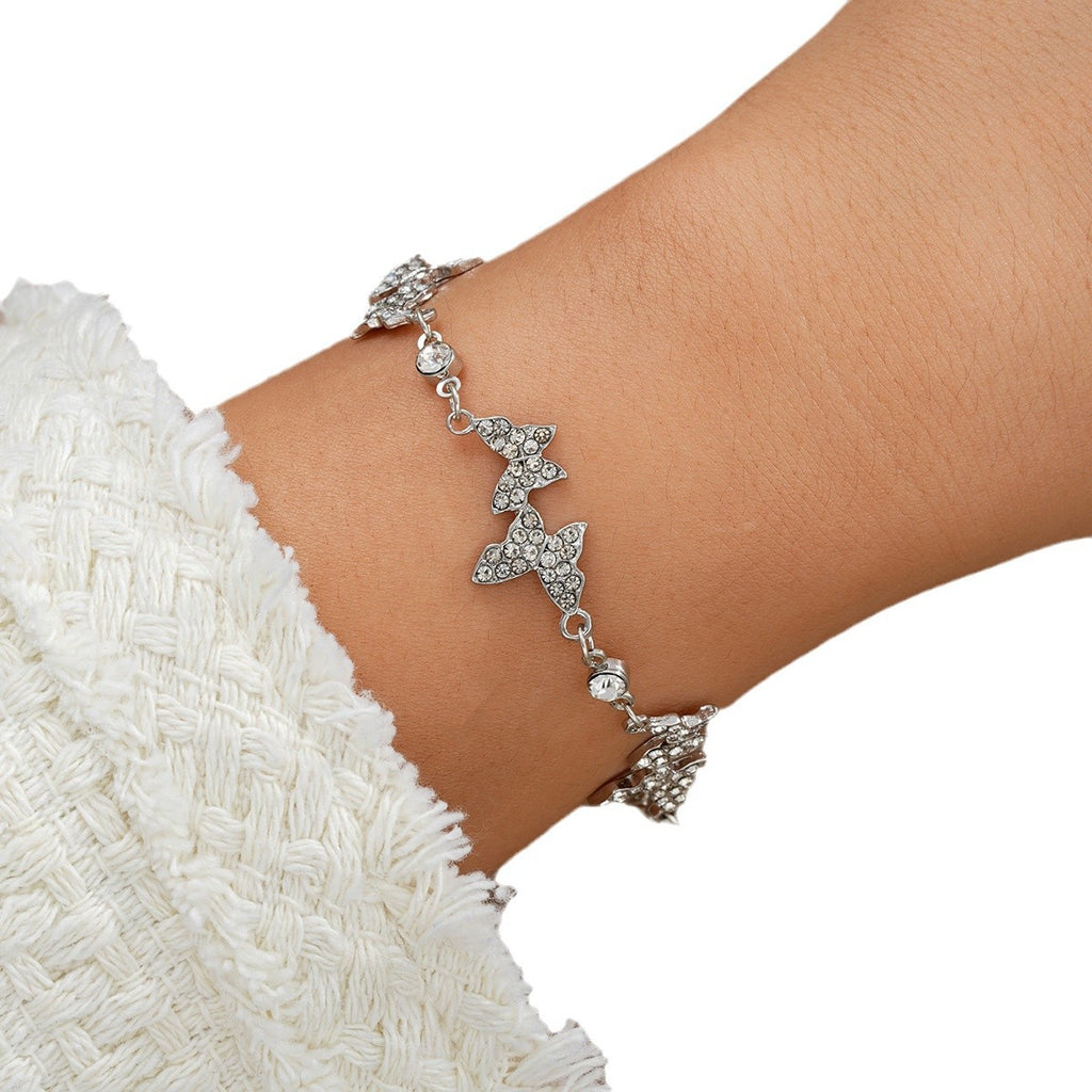 Damenarmband mit funkelnden Schmetterlingen Shop Nory