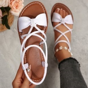 Damen Zarte Römersandalen mit Schleifen-Detail und verstellbaren Schnürriemen Shop Nory