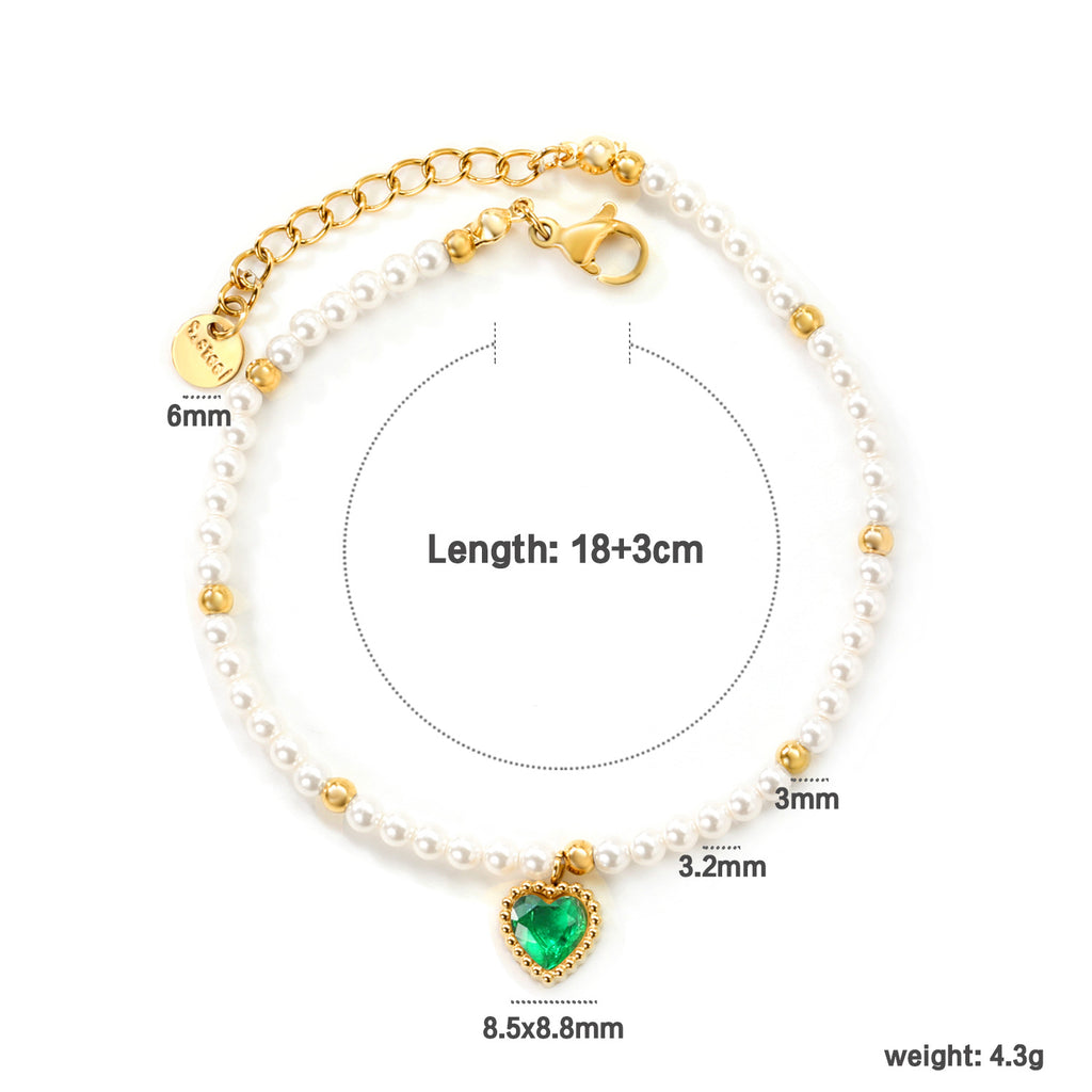 Damen Armband mit schimmernden goldenen Perlen und funkelndem Herzanhänger Shop Nory