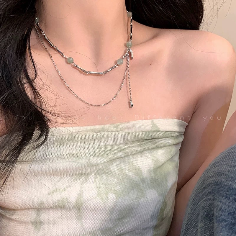 Damen Halskette mit filigranen Gliederketten und eleganten Edelsteinanhängern Shop Nory