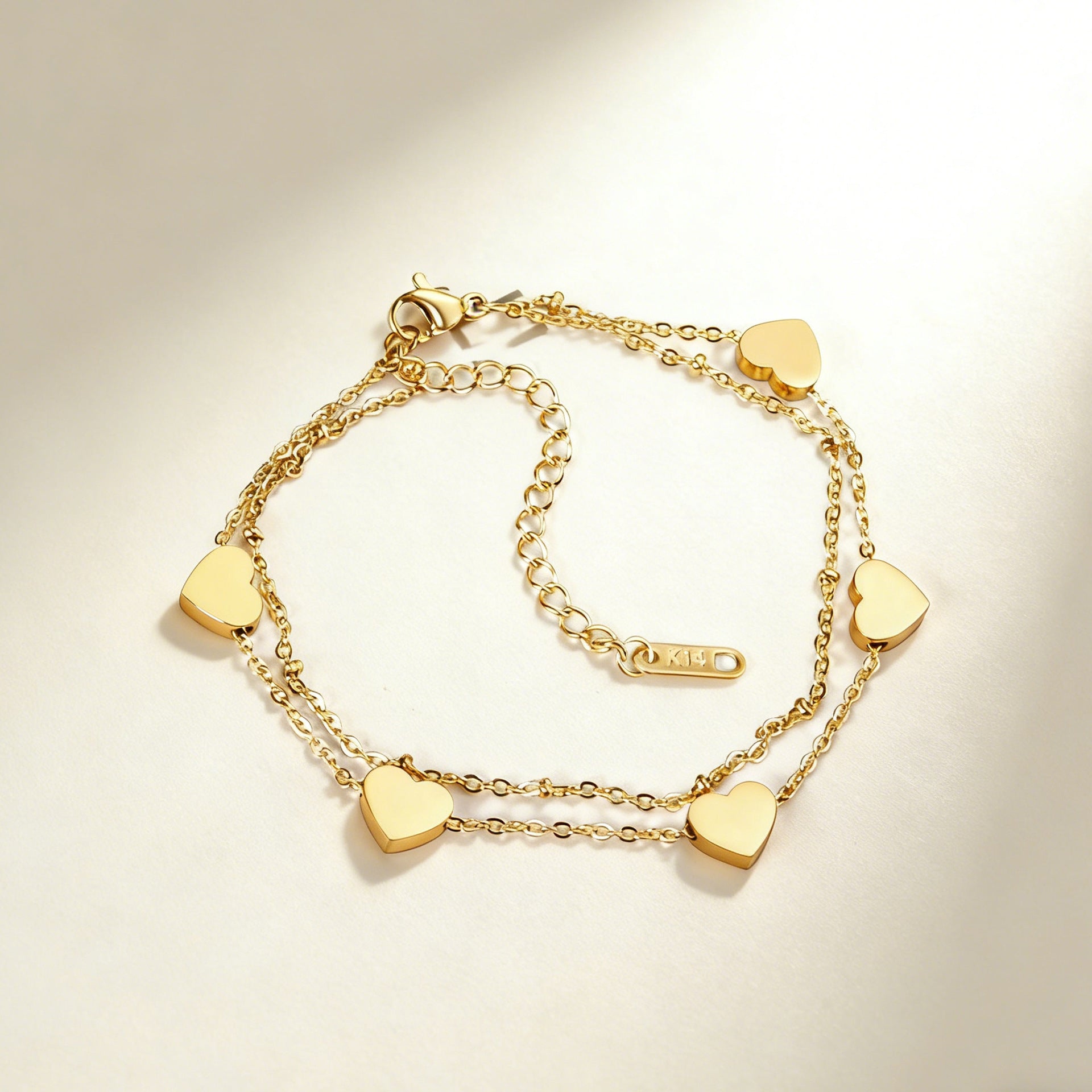Damen Armband mit herzförmigen Anhängern aus hochwertigem Edelstahl und 14K Goldbeschichtung Shop Nory