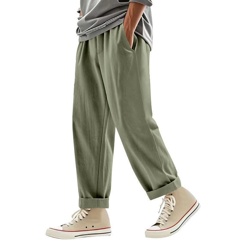 Herren nan weite Bundfalten-Chinohose mit Umschlag, konisch zulaufendem Schnitt und seitlichen Eingrifftaschen