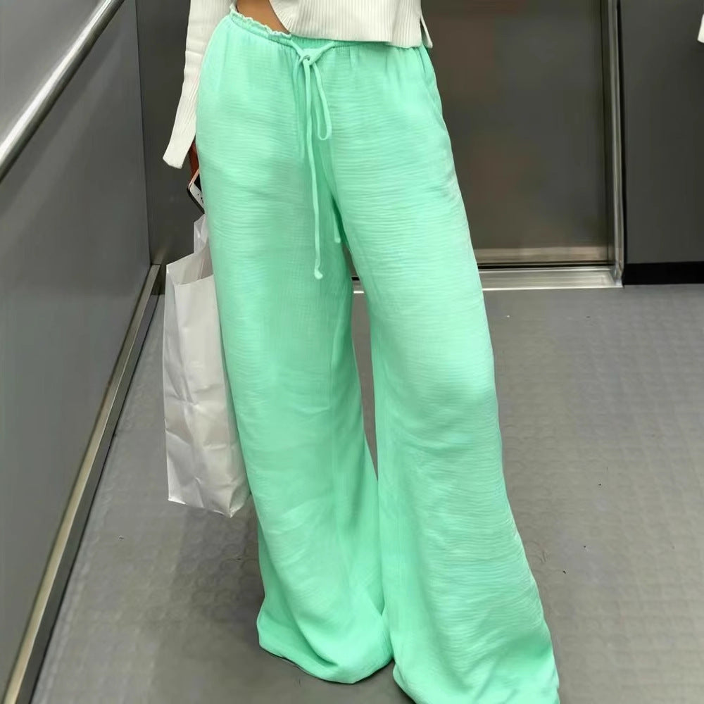 Damen Leinenhose mit lockerer, knöchellanger Passform, seitlichen Eingrifftaschen und Zierknopf-Details Shop Nory