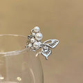 Damen Eleganter und romantischer Ring mit Zierperlen und Schmetterling Shop Nory