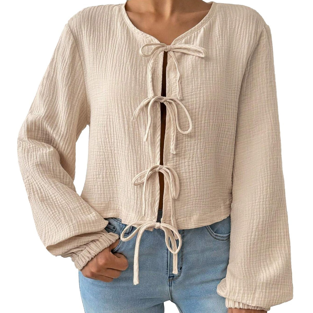 Damen kurz geschnittene Musselinbluse mit Knotenverschlüssen und Ballonärmeln Shop Nory